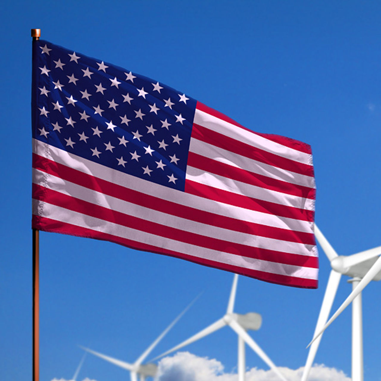 American flag with wind turbines in the background